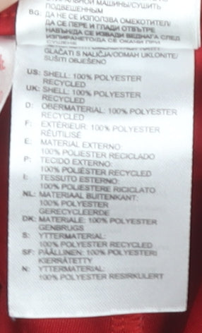 Brand and care label for Adidas boys’ red athletic shorts - gym & training