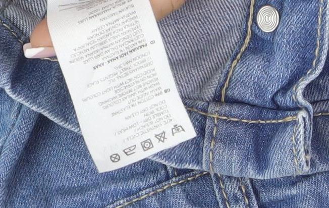 Brand and care label for Mantaray girls’ blue denim a-line skirt, age 9, casual & stylish