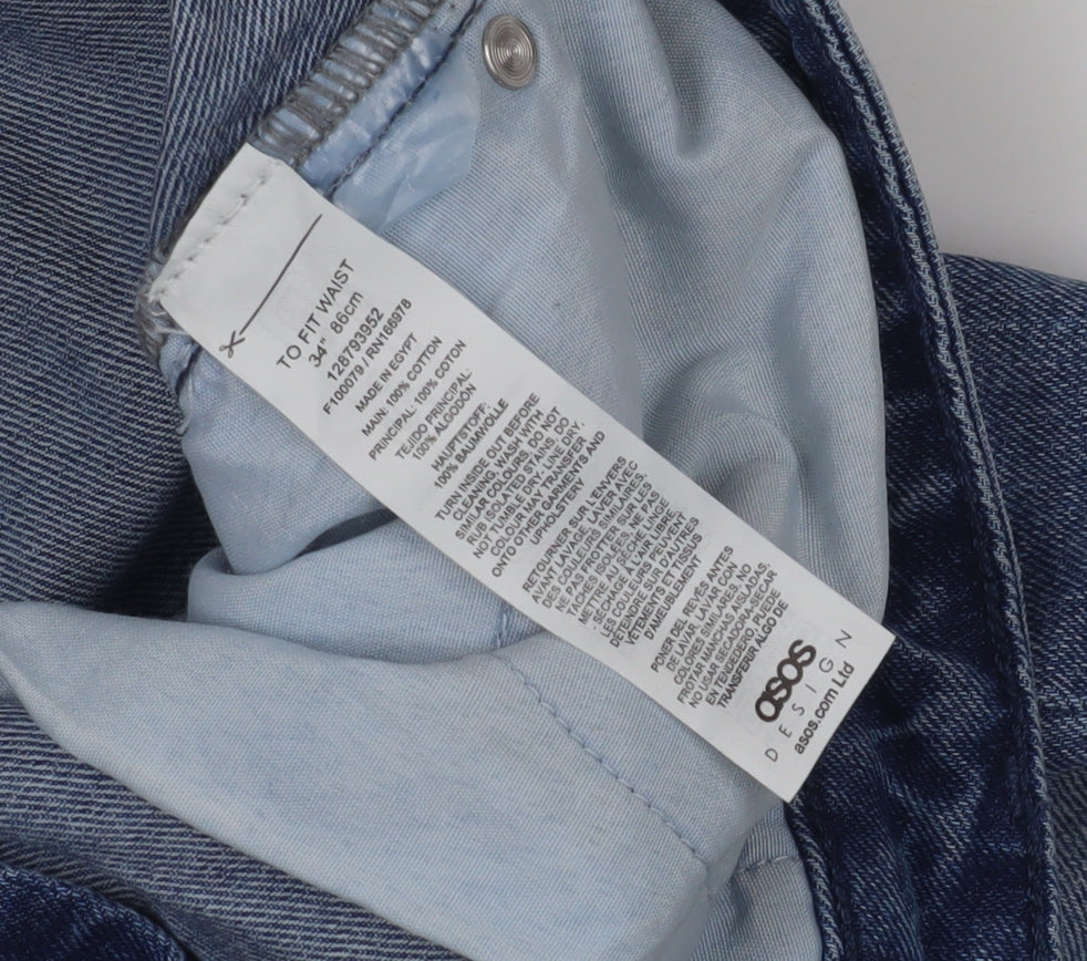 Close-up detail of ASOS Design Men's Blue Denim Distressed Shorts, size 34