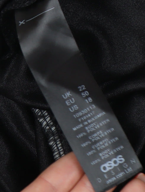Brand and care label for ASOS DESIGN Women's Black Plus Wrap Blouse, size 22