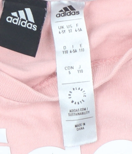 Brand and care label for Adidas girls’ pink t-shirt, 4-5 years, short sleeve, breathable