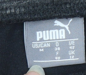 Brand and care label for Puma Men's Grey Jogger Trousers, size M