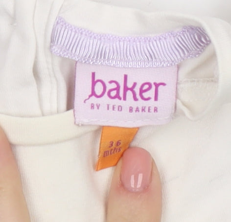 Brand and care label for Ted Baker girls’ ivory floral blouse 36m party style