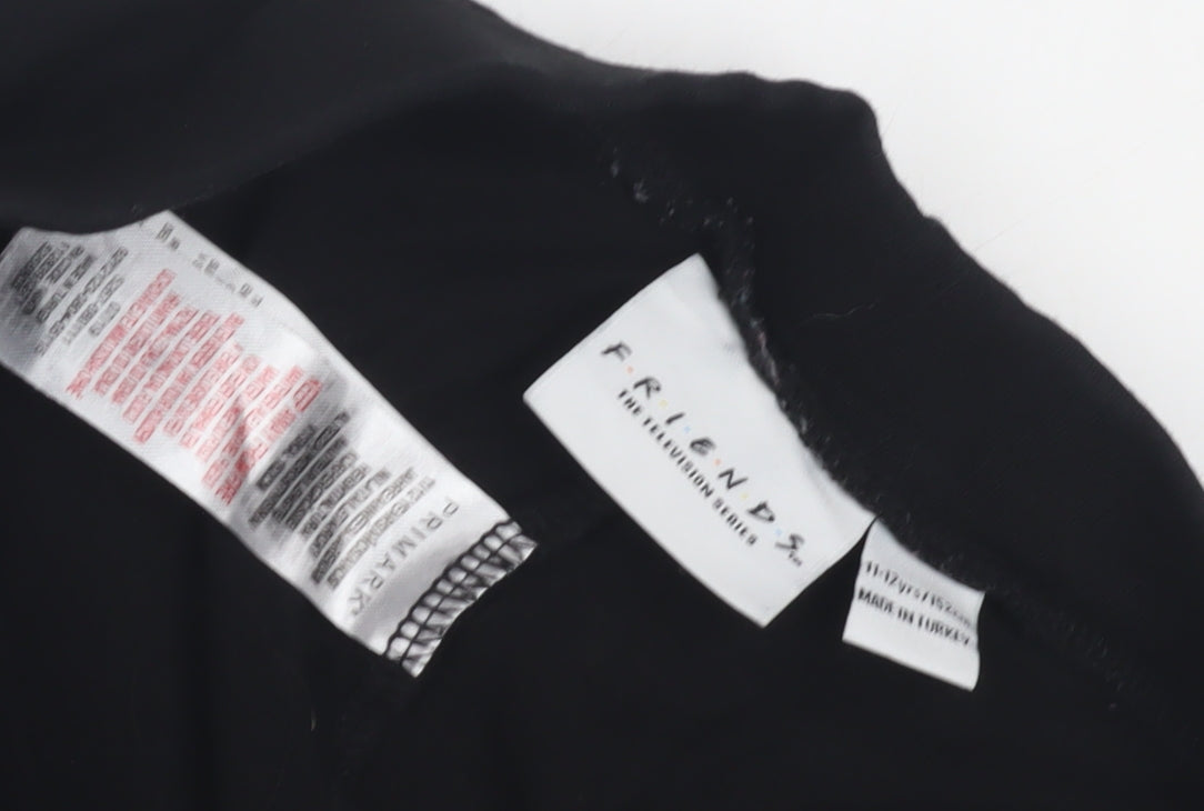 Close-up detail of Primark girls’ black friends leggings 11-12 years tv theme