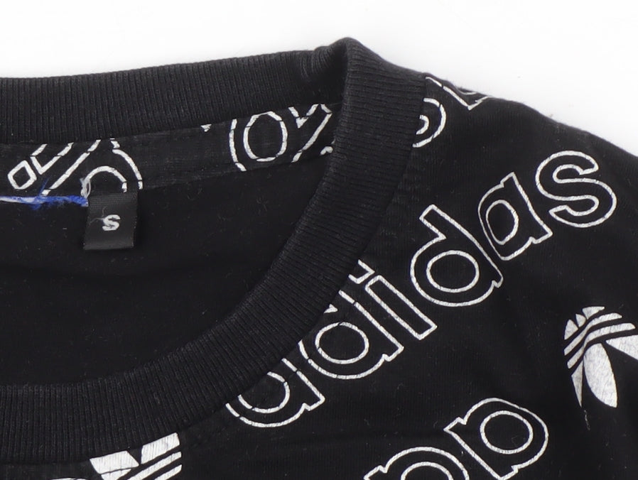Close-up detail of Adidas boys’ black graphic print t-shirt s