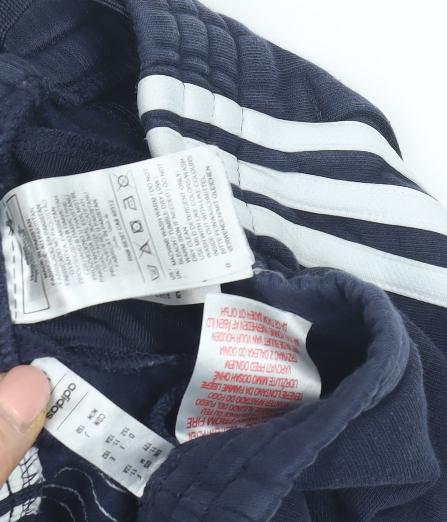 Close-up detail of Adidas boys’' blue track pants, size 12, sporty striped style