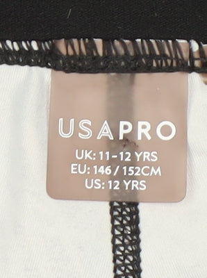 Close-up detail of USA Pro girls’ multicoloured tropical leggings 11-12 years