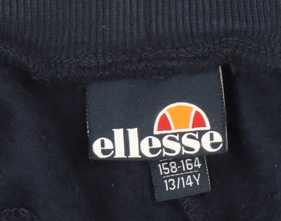 Brand and care label for Ellesse girls’ blue jogger trousers 13-14 years