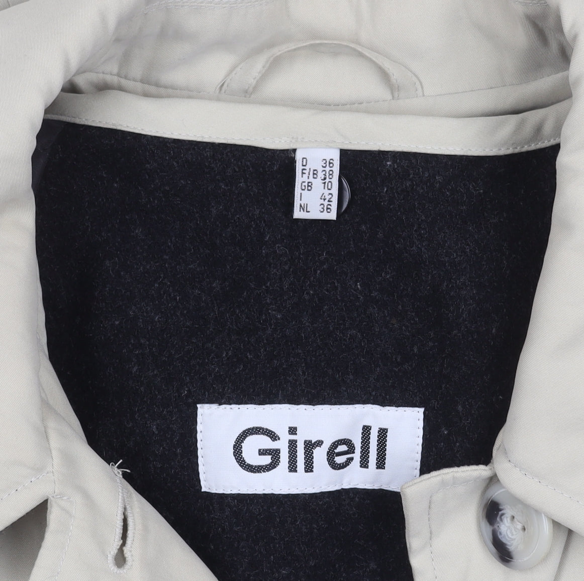 Brand and care label for Girell women’s beige overcoat, size UK 36, button closure