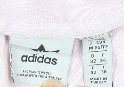 Close-up detail of Adidas Women's Pink T-Shirt, size 4, Logo Design