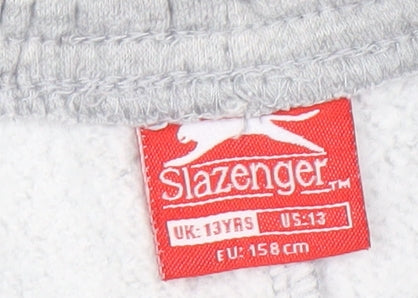 Brand and care label for Slazenger boys’ grey jogger trousers 13 years