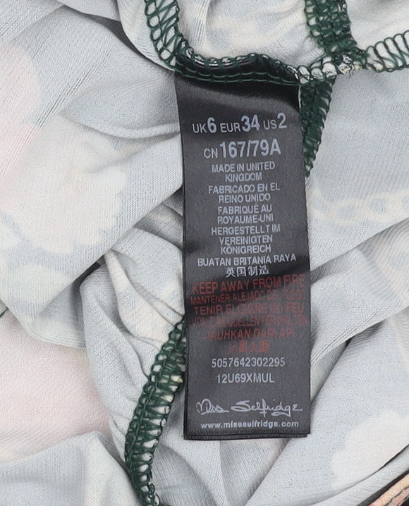 Brand and care label for Miss Selfridge Women's Black Floral Bodysuit, size 6