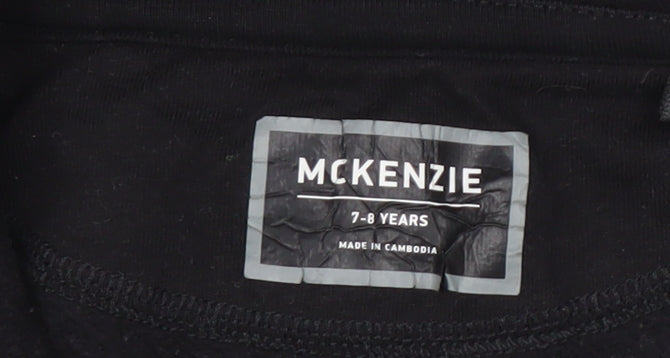 Brand and care label for McKenzie boys’ black zip-up fleece jacket 7-8 years