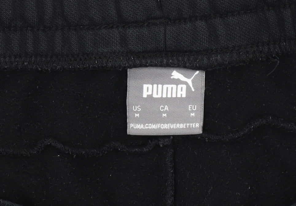 Close-up detail of Puma Men's Black Sweatpants, size M, Jogger Style
