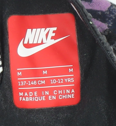 Brand and care label for Nike girls’ multicoloured leggings 10-12 years graphic sports