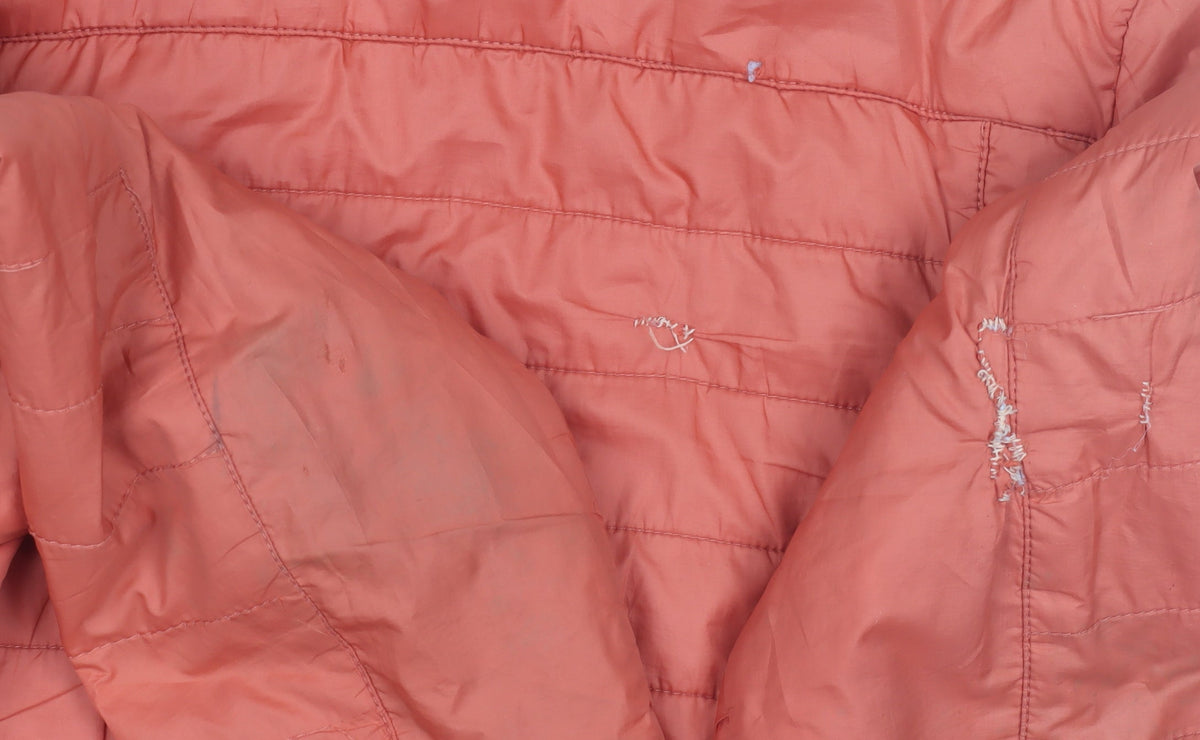 Brand and care label for Decathlon girls’ orange puffer jacket - 14 years, hooded, mid-length