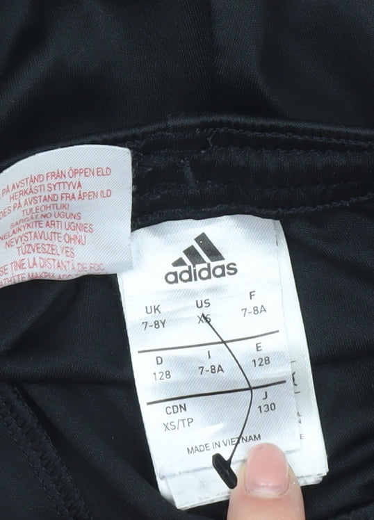 Brand and care label for Adidas boys’ black athletic football shorts 7-8 years