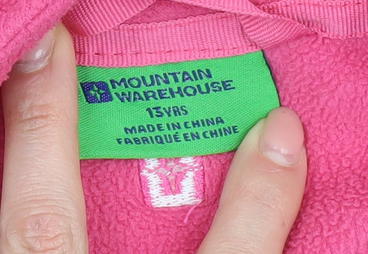 Brand and care label for Mountain Warehouse girls’ pink fleece jacket 13 years