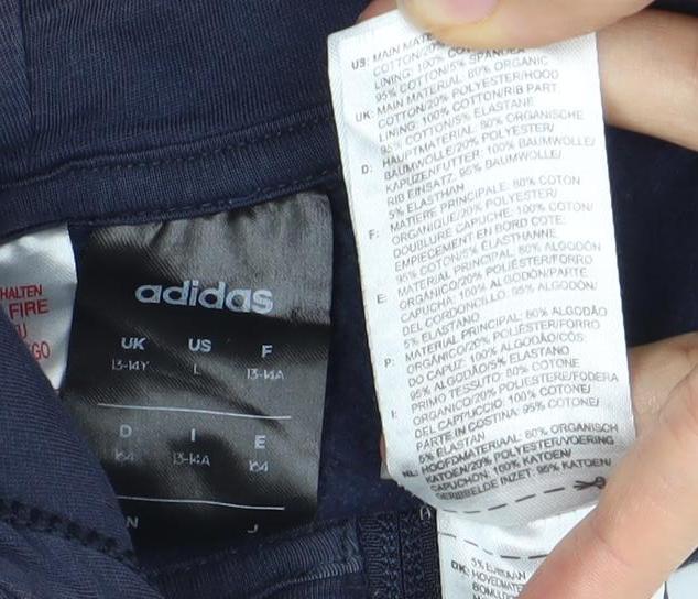 Close-up detail of Adidas boys’ blue zip hoodie l - full zip sportswear