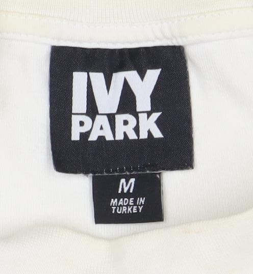 Close-up detail of Ivy Park Women's M Ivory Pullover Sweatshirt