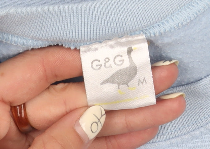 Brand and care label for G&G Women's Blue Embroidered Pullover Sweatshirt, Medium