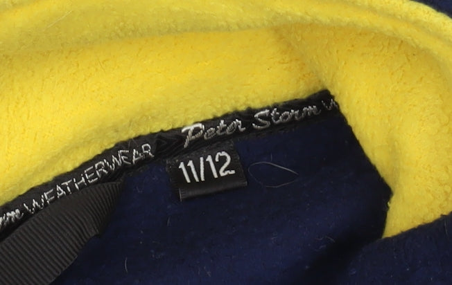 Brand and care label for Peter Storm boys’ blue fleece jacket 11 years