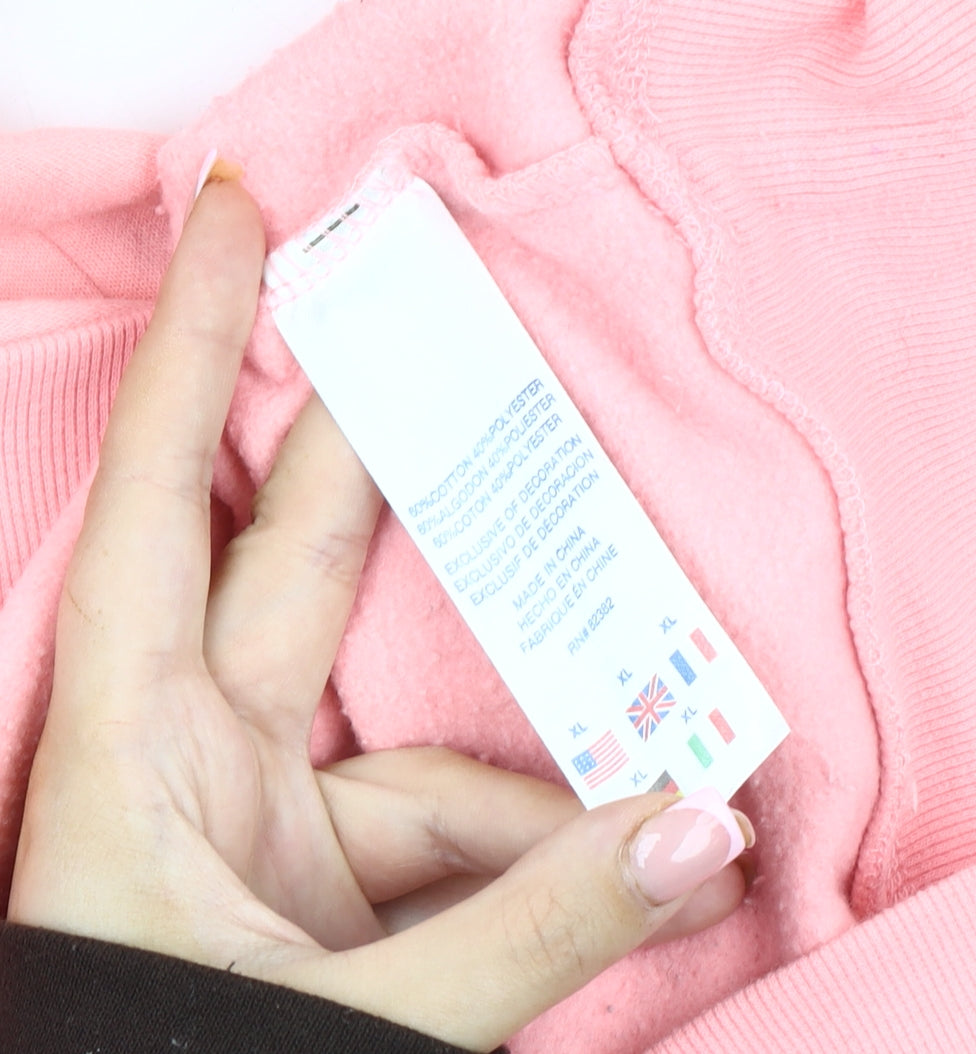 Brand and care label for Champion girls’ pink xl pullover sweatshirt with logo