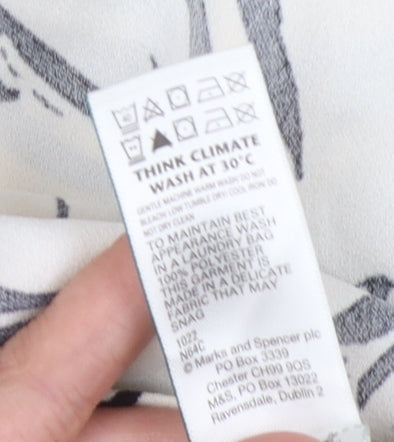 Brand and care label for Marks & Spencer Women's Black Floral Blouse, size 16, Petite