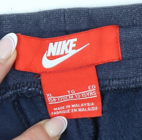 Close-up detail of Nike boys’ blue jogger trousers xl