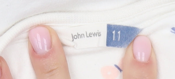 Brand and care label for John Lewis girls’ white fairy t-shirt, 11 years