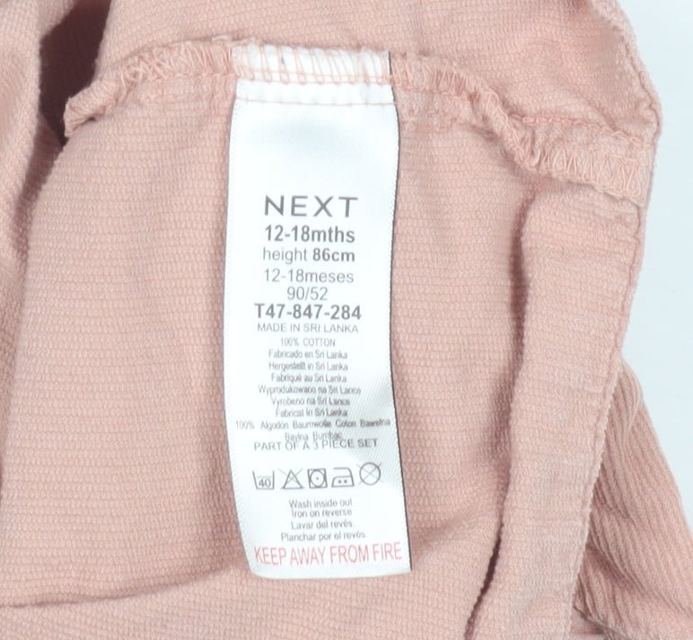 Close-up detail of Next girls’ pink pinafore dress, 12-18 months, cotton