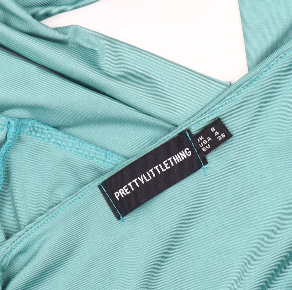Close-up detail of PRETTYLITTLETHING Women’s Green Long Sleeve Top