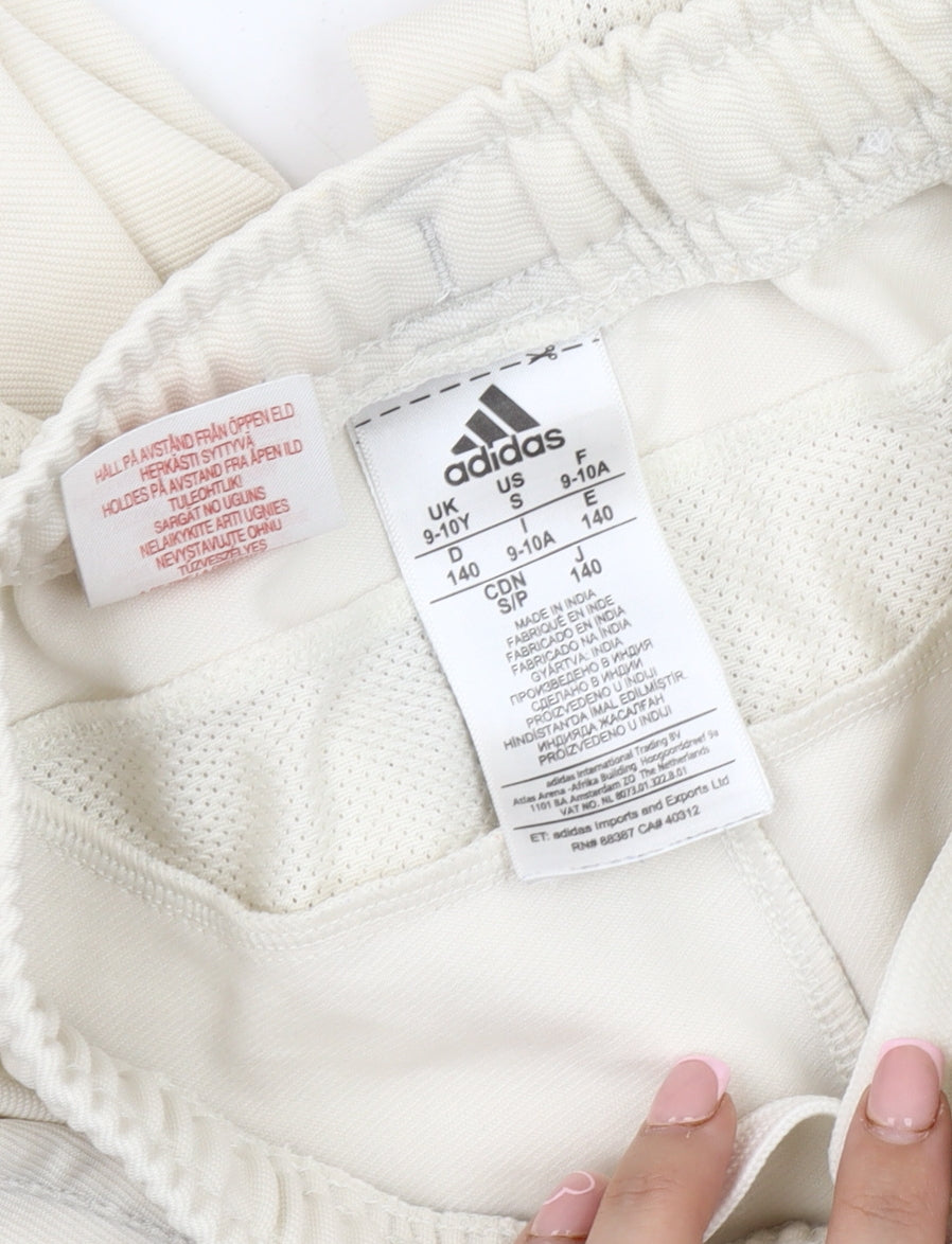 Close-up detail of Adidas boys’ ivory track pants 9-10 years athletic wear