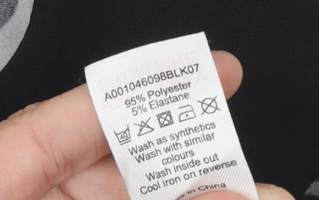 Brand and care label for David Emanuel Women's Black Animal Print Dress, size 12
