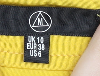 Brand and care label for Missguided Women's Yellow Geometric Skirt, size 10, Polyester