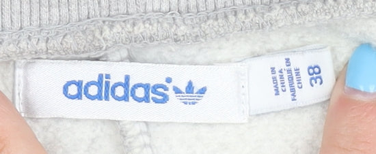 Brand and care label for Adidas Women's Grey Jogger Trousers, size 10