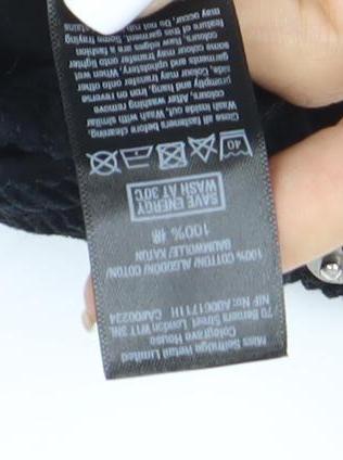Brand and care label for Miss Selfridge Women's Black Corduroy Skirt, size 6