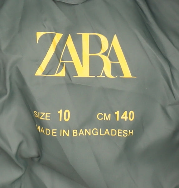 Brand and care label for Zara boys’ green puffer jacket, size 10, winter essential