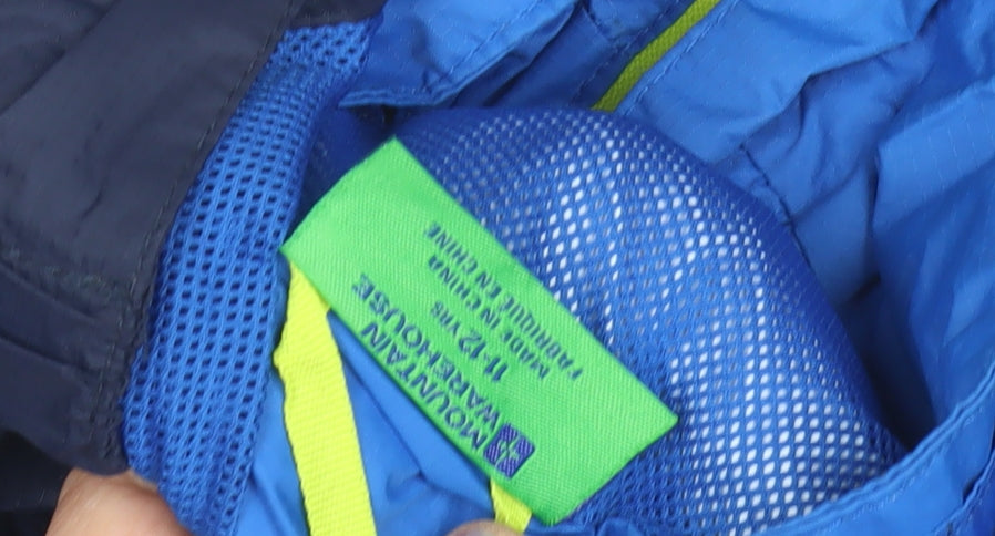 Close-up detail of Mountain Warehouse boys’ blue windbreaker jacket, size 14