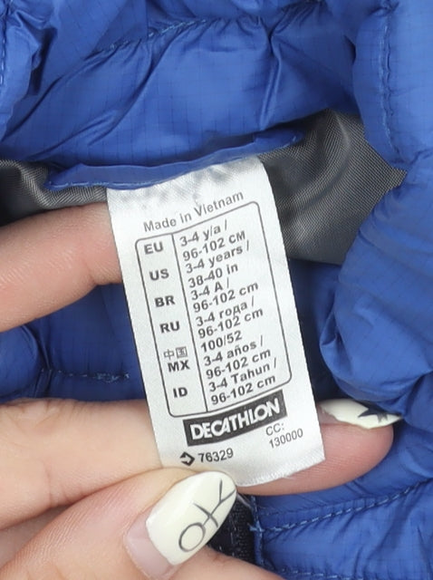 Brand and care label for Decathlon boys’ blue puffer jacket 4-5 years
