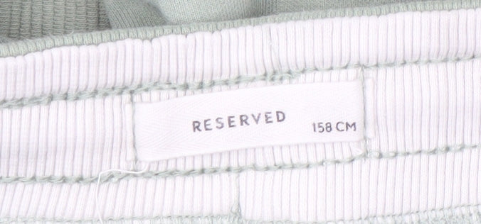 Close-up detail of RESERVED boys’ green jogger trousers - size 12y