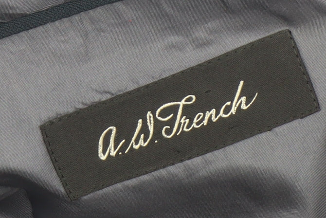 Brand and care label for A.W. Trench Men's Blue Wool Blazer, 38L Double-Breasted