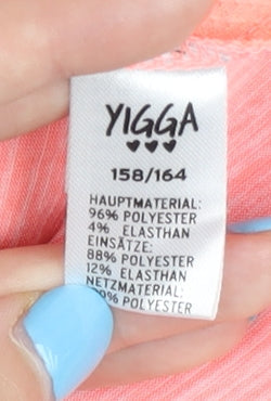 Close-up detail of Yigga girls’ pink t-shirt, 12-13 years, breathable activewear
