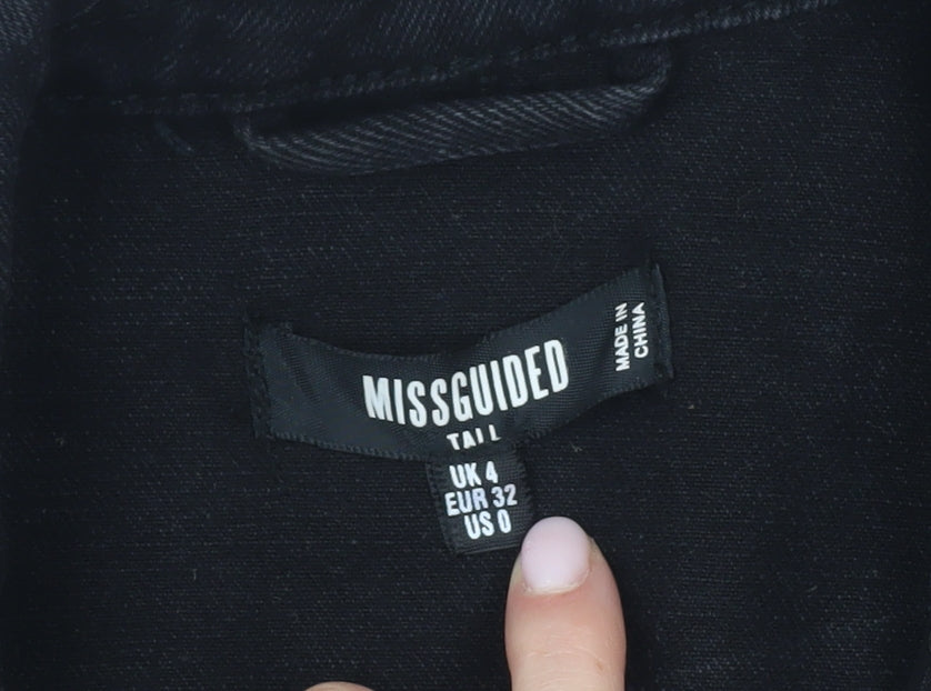 Brand and care label for Missguided Women's Black Denim Jacket, size 4, Casual Style