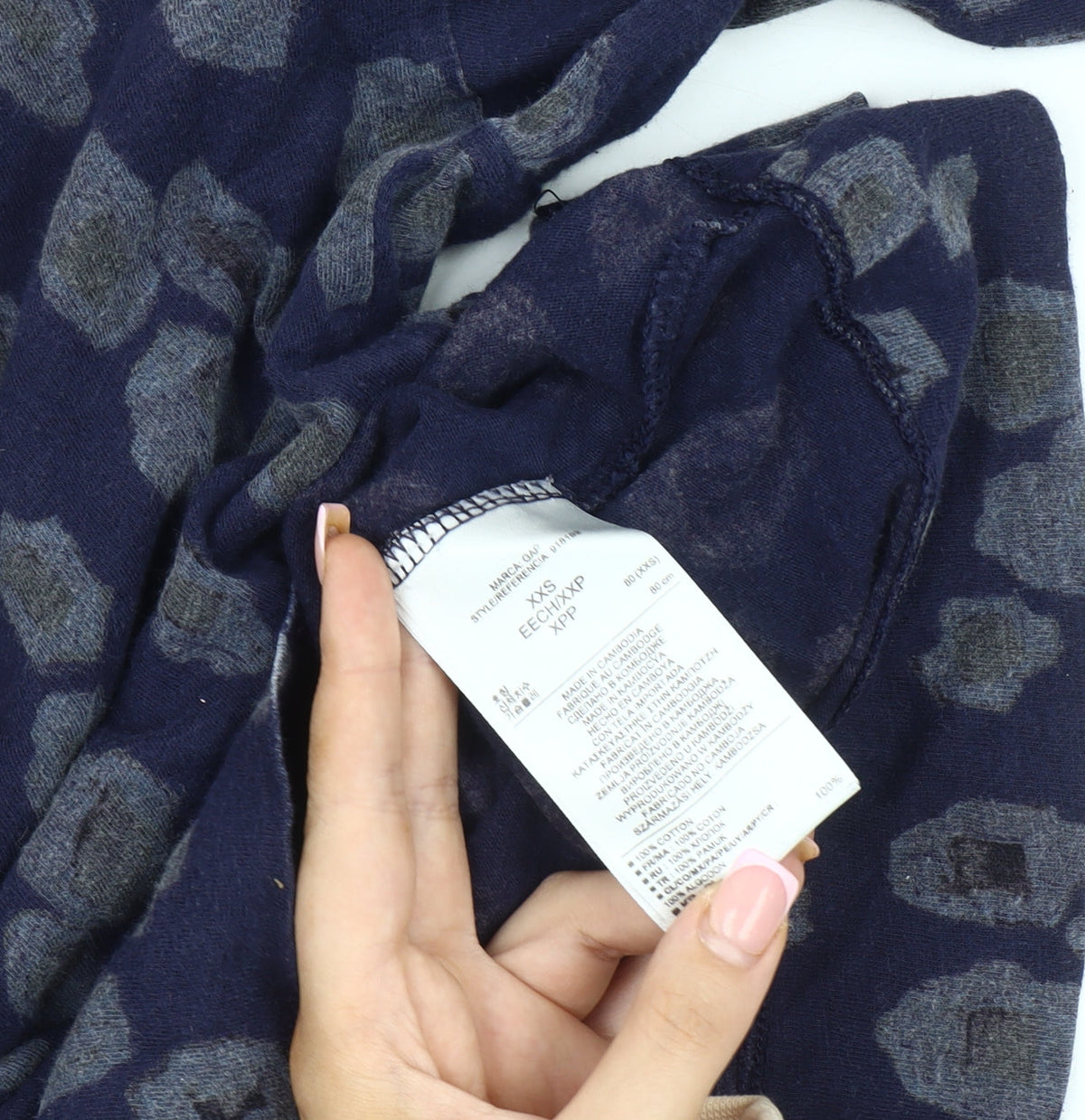 Brand and care label for Gap Women's Blue XXS Boat Neck Animal Print Top