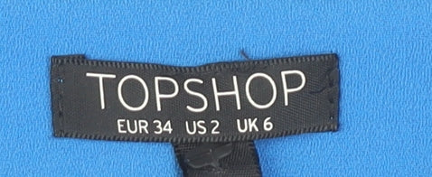 Close-up detail of Topshop Blue Belted Tapered Trousers, size 6