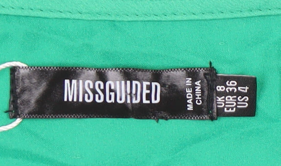 Brand and care label for Missguided Women's Green Wrap Dress, size 8