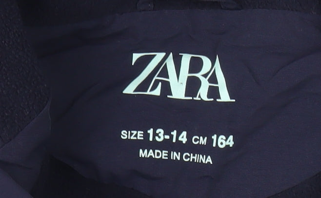 Brand and care label for Zara girls’ blue anorak jacket, 13-14 years, hooded, lined