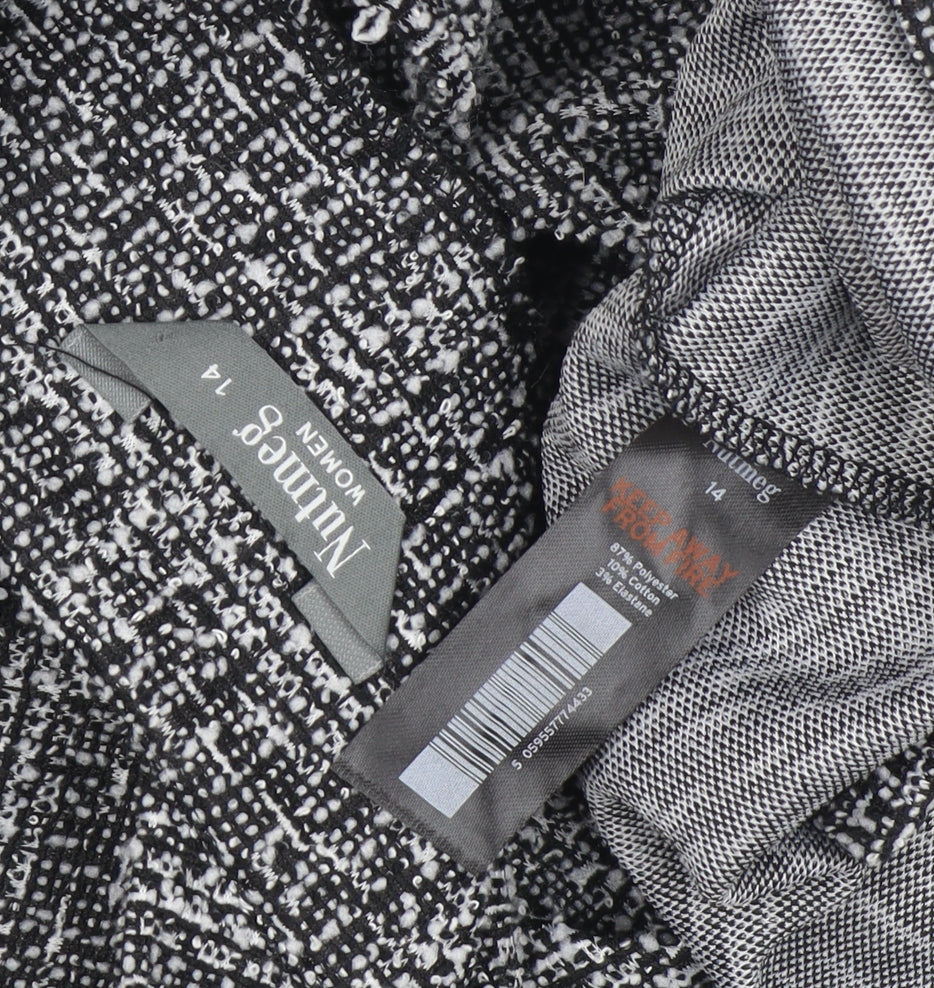 Close-up detail of Nutmeg Women's Black Check Pinafore Dress, size 14