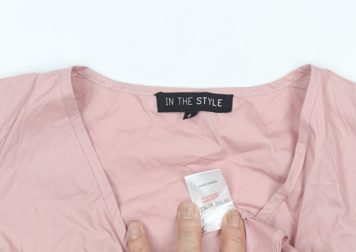Close-up detail of In The Style Women's Pink Wrap Blouse, size 8